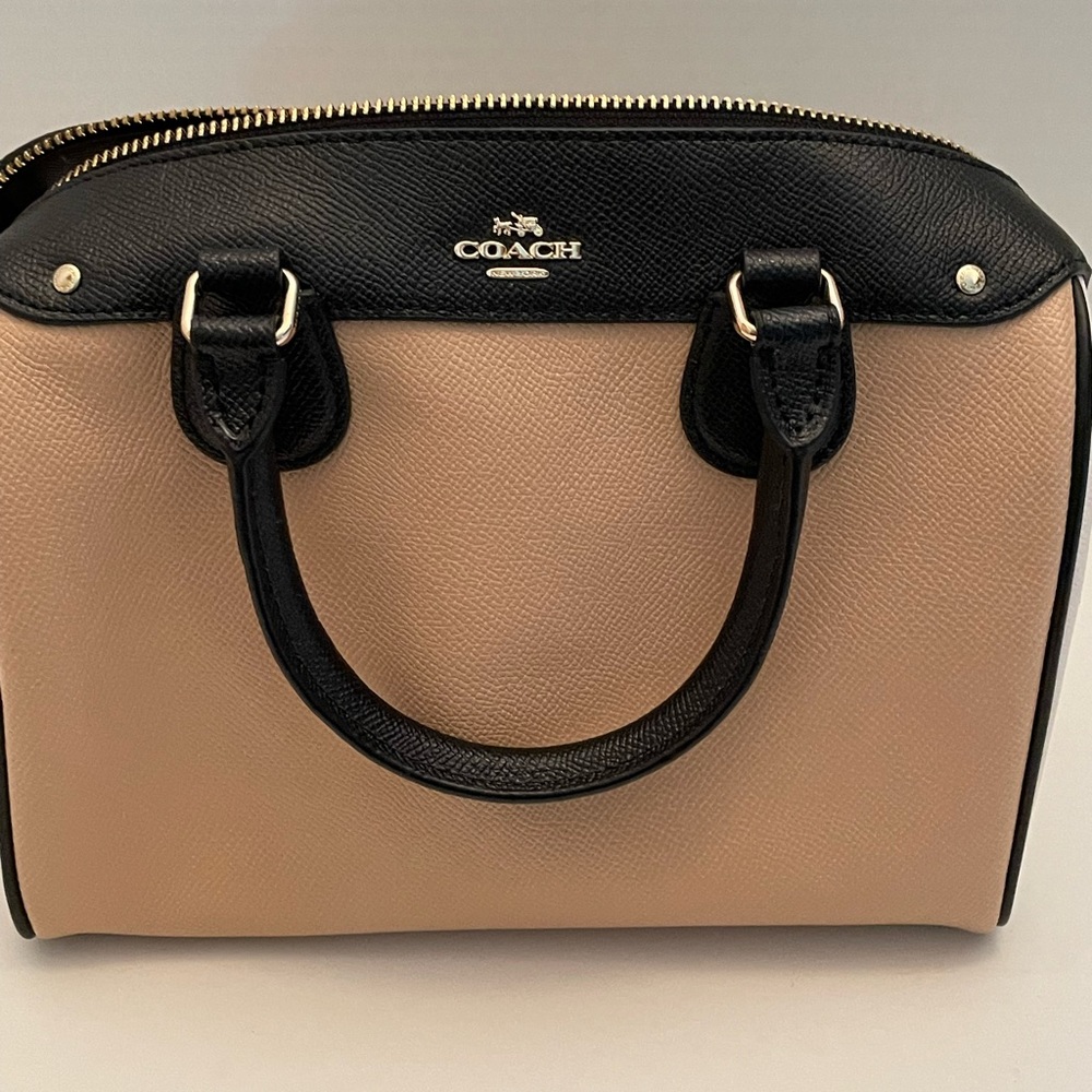 Coach color block convertible satchel/crossbody in white, tan, and black.